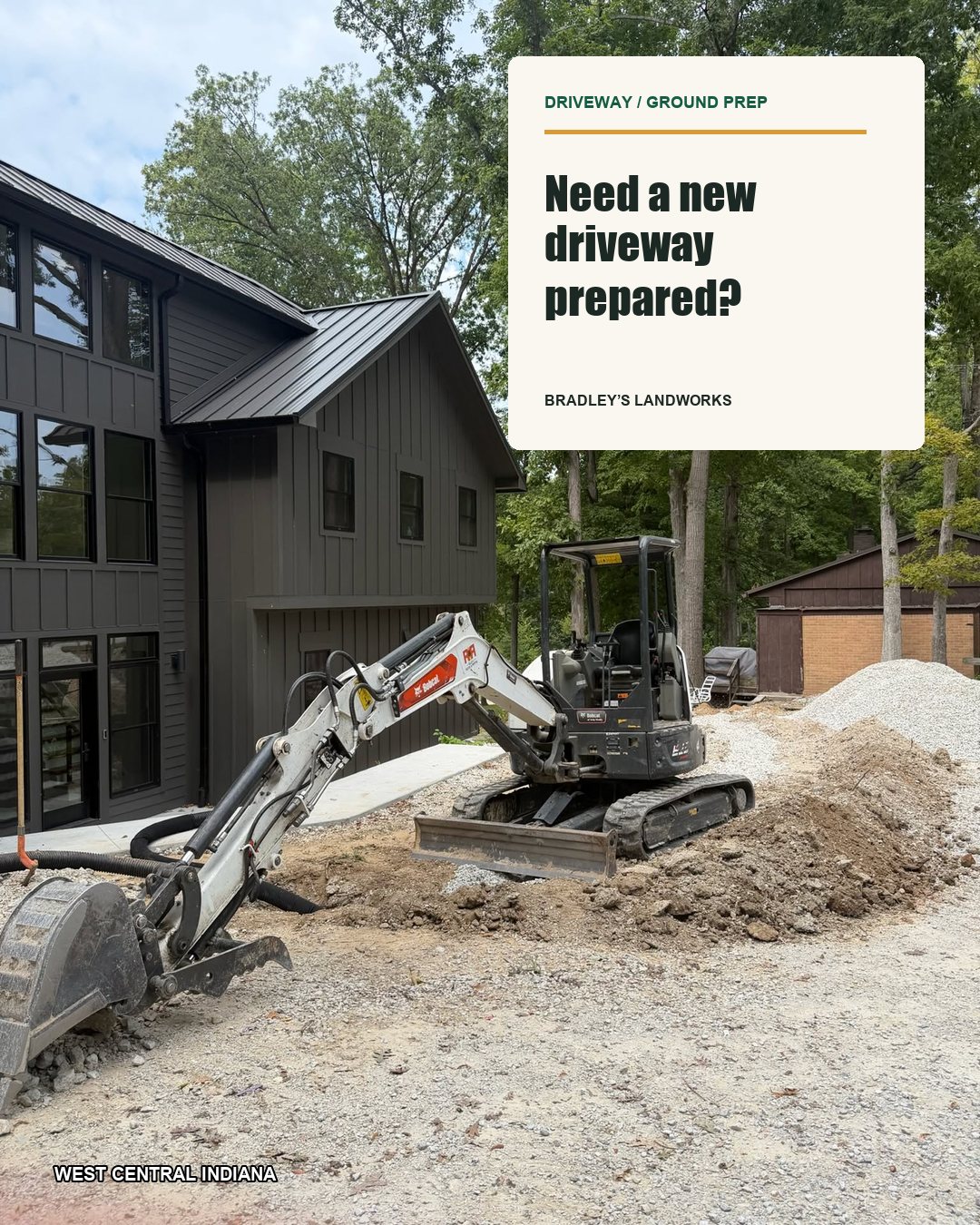 Mini excavator prepping a gravel driveway beside a new home